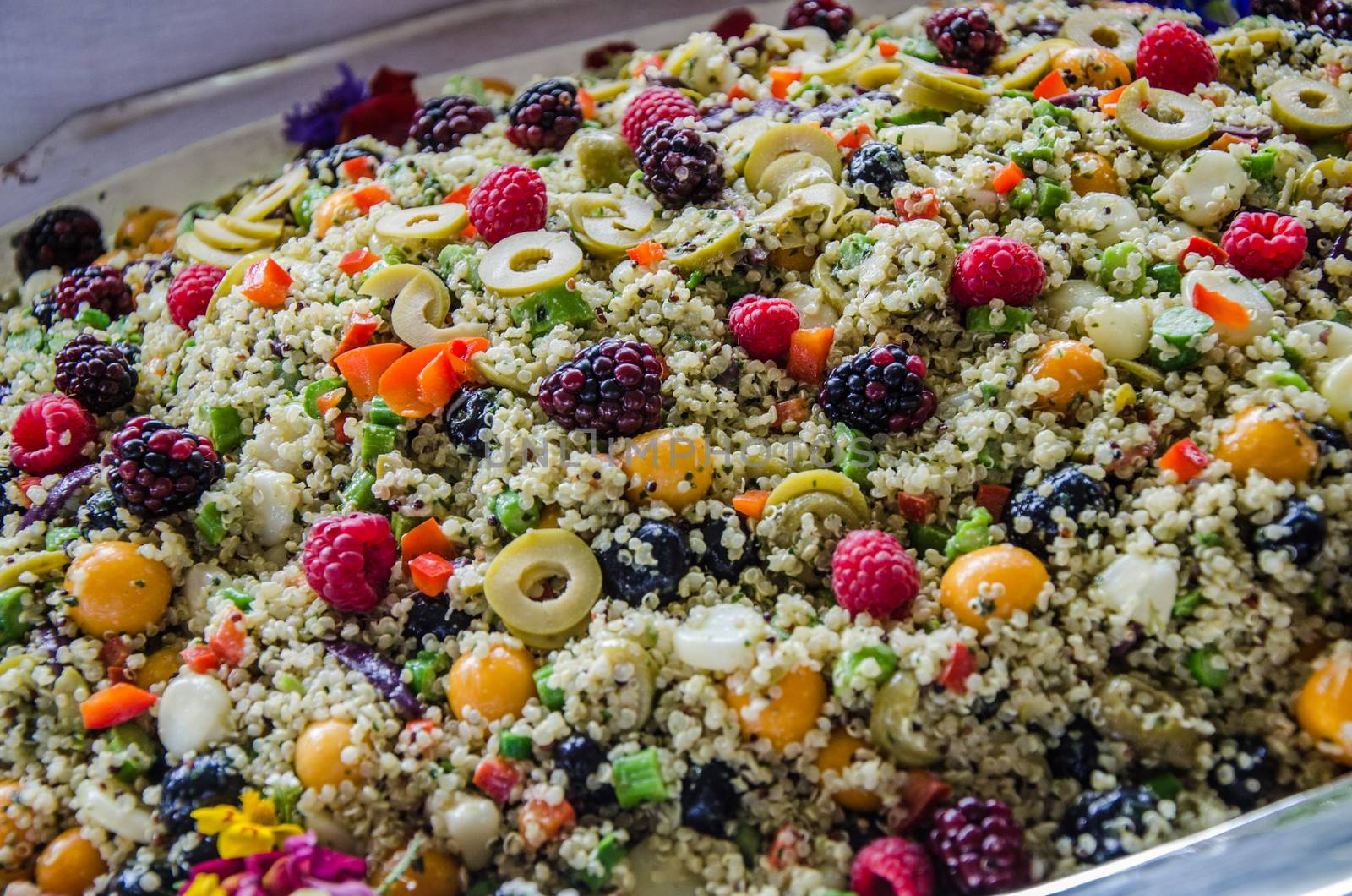 Peruvian salad called Chola Power with quinoa, aguaymanto, blueberries, corn, olives, peppers condiments