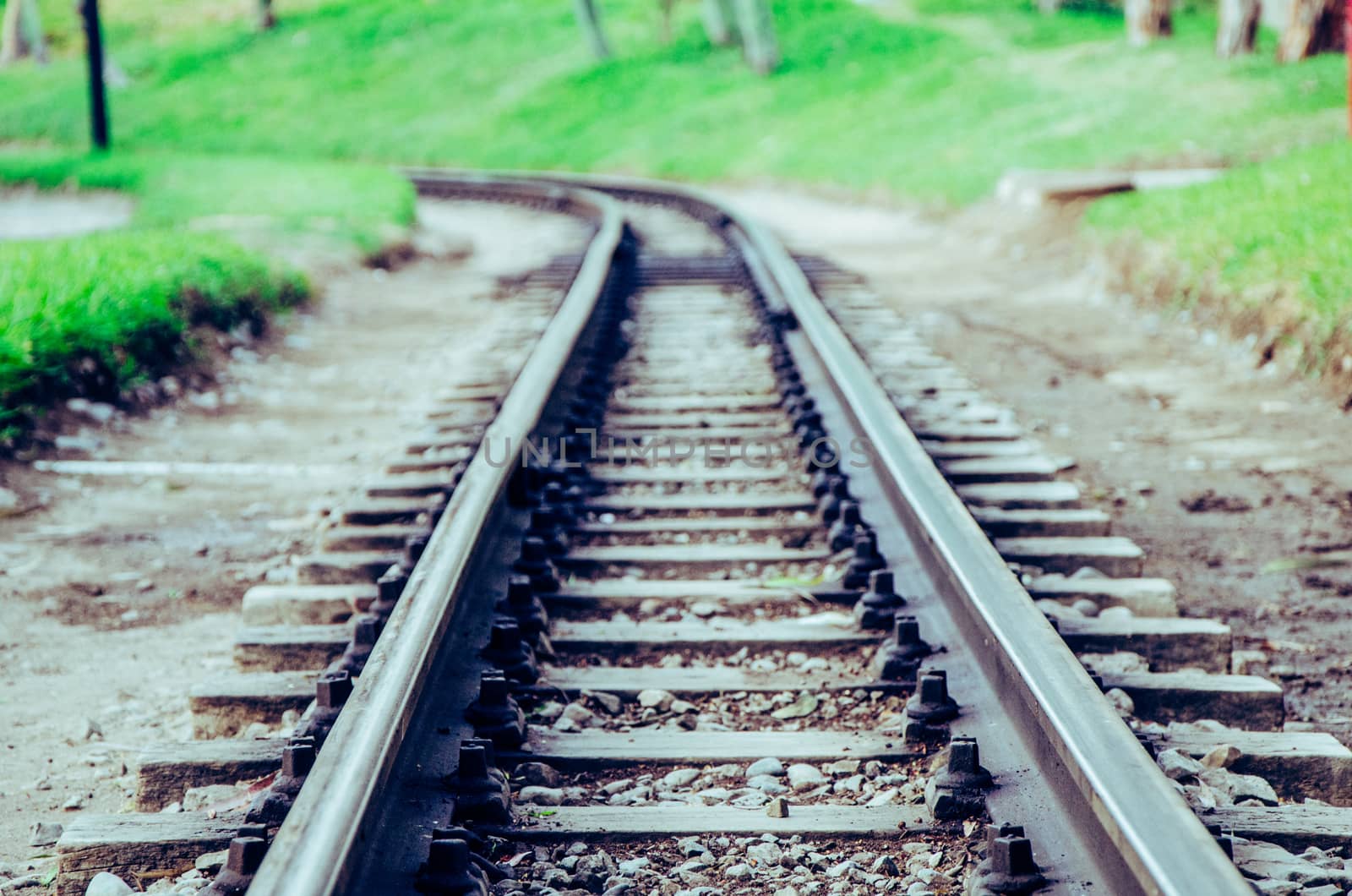 Damaged vintage railway, between mountains and bushes