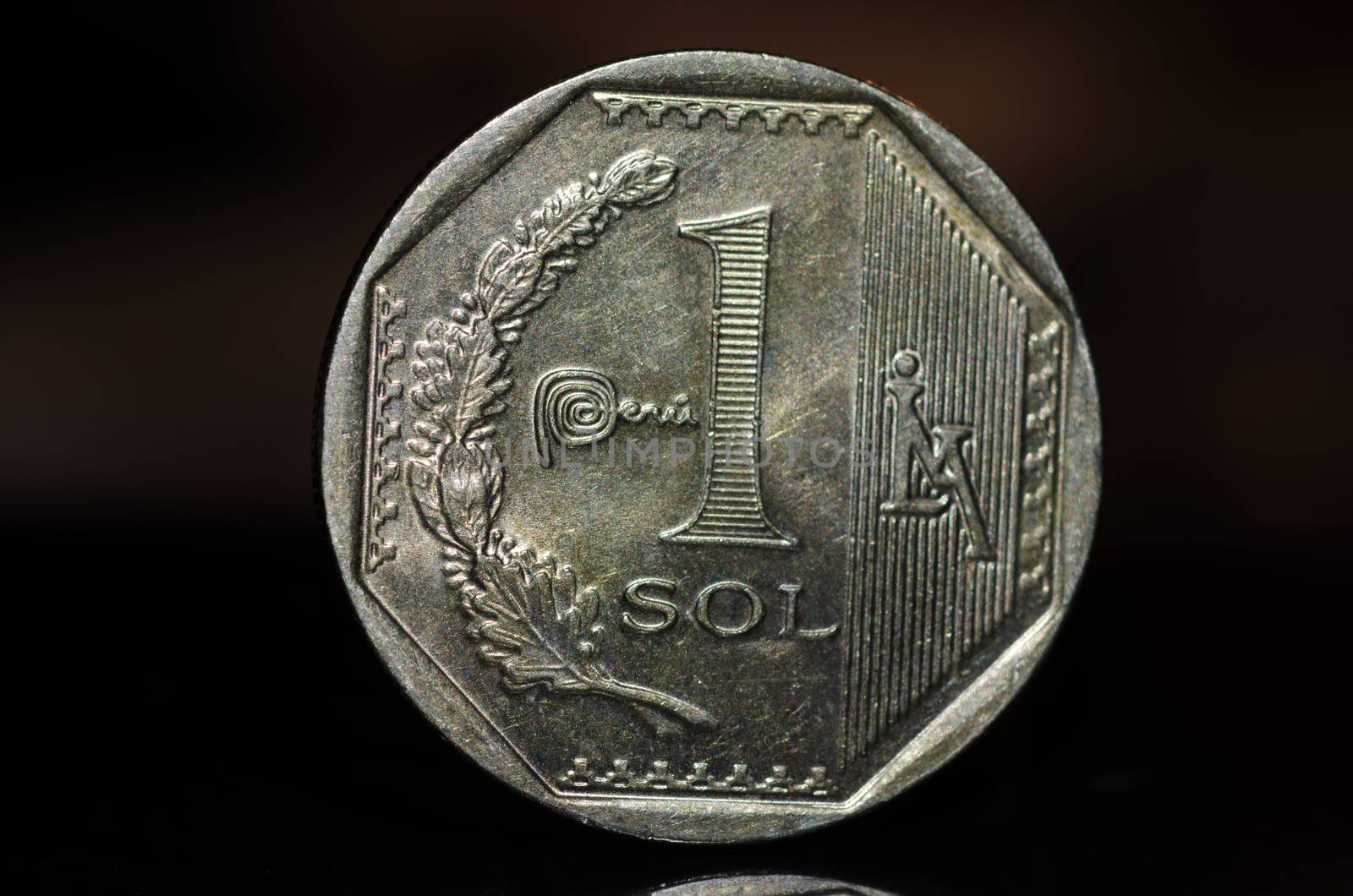 1 Peruvian nuevo sol coin isolated on black background