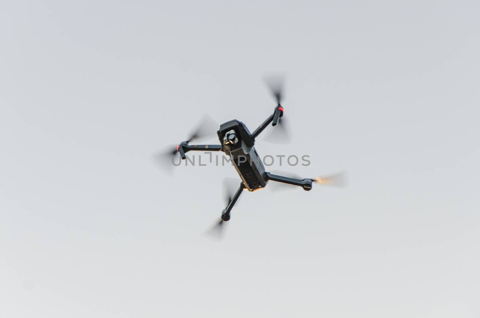 drone quadcopter with digital camera in the air