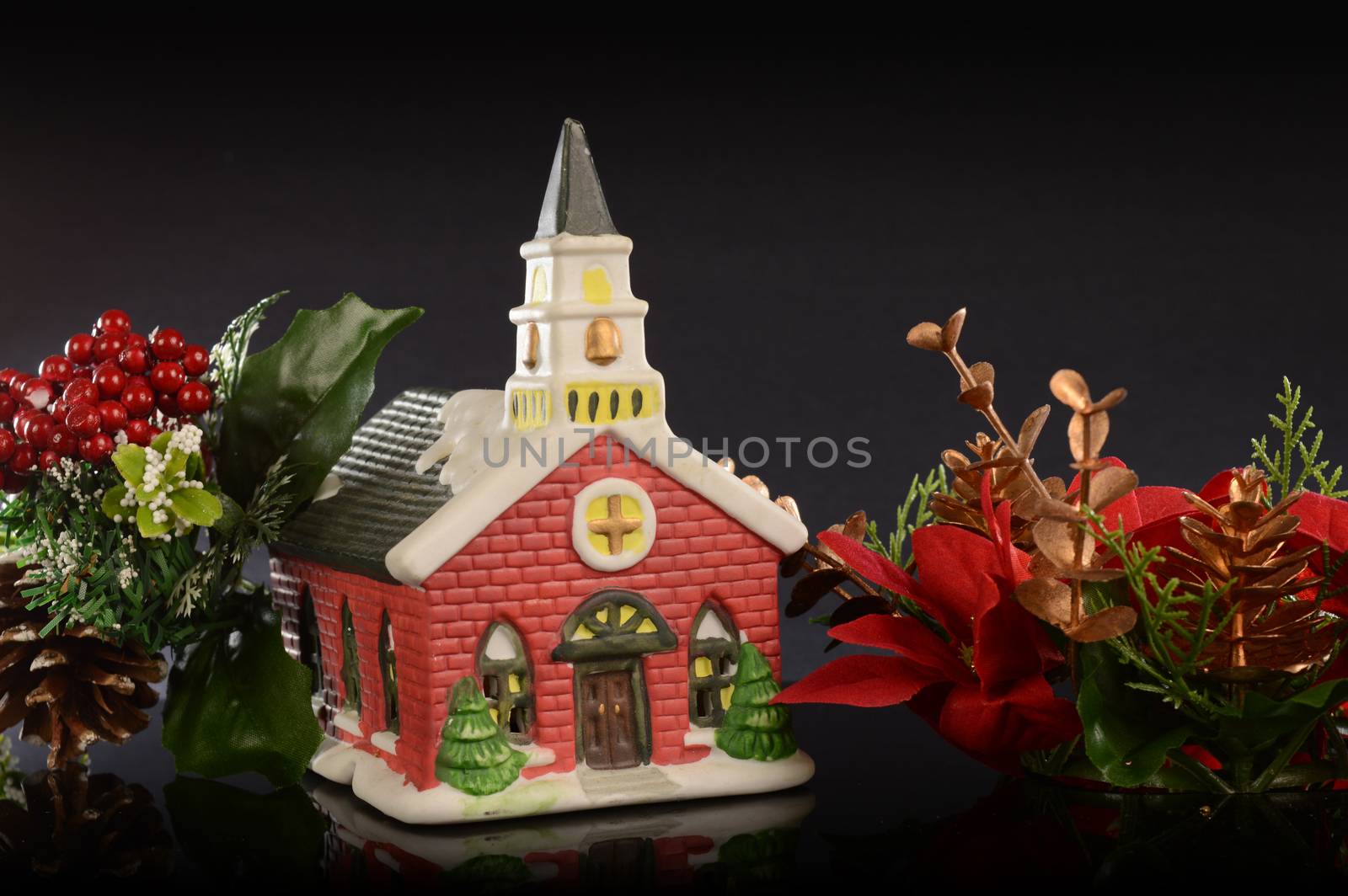 A closeup image of a Christmas church scene decorated for the holiday season.