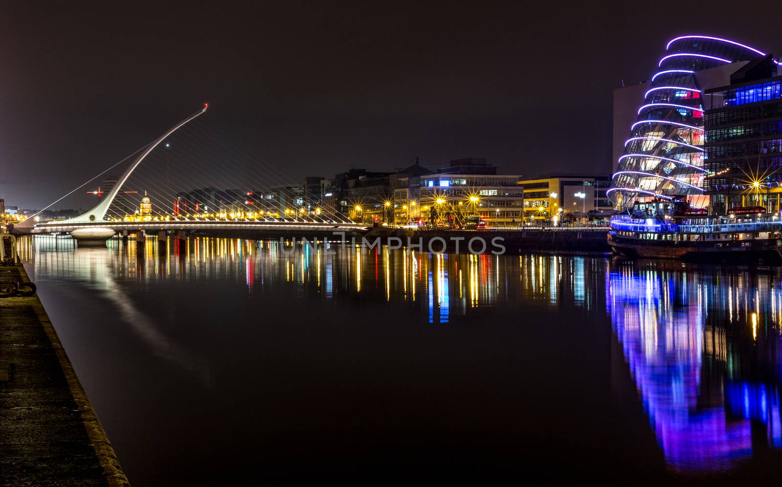 Dublin Ireland River Liffey at Night with harp bridge reflections night by mlechanteur