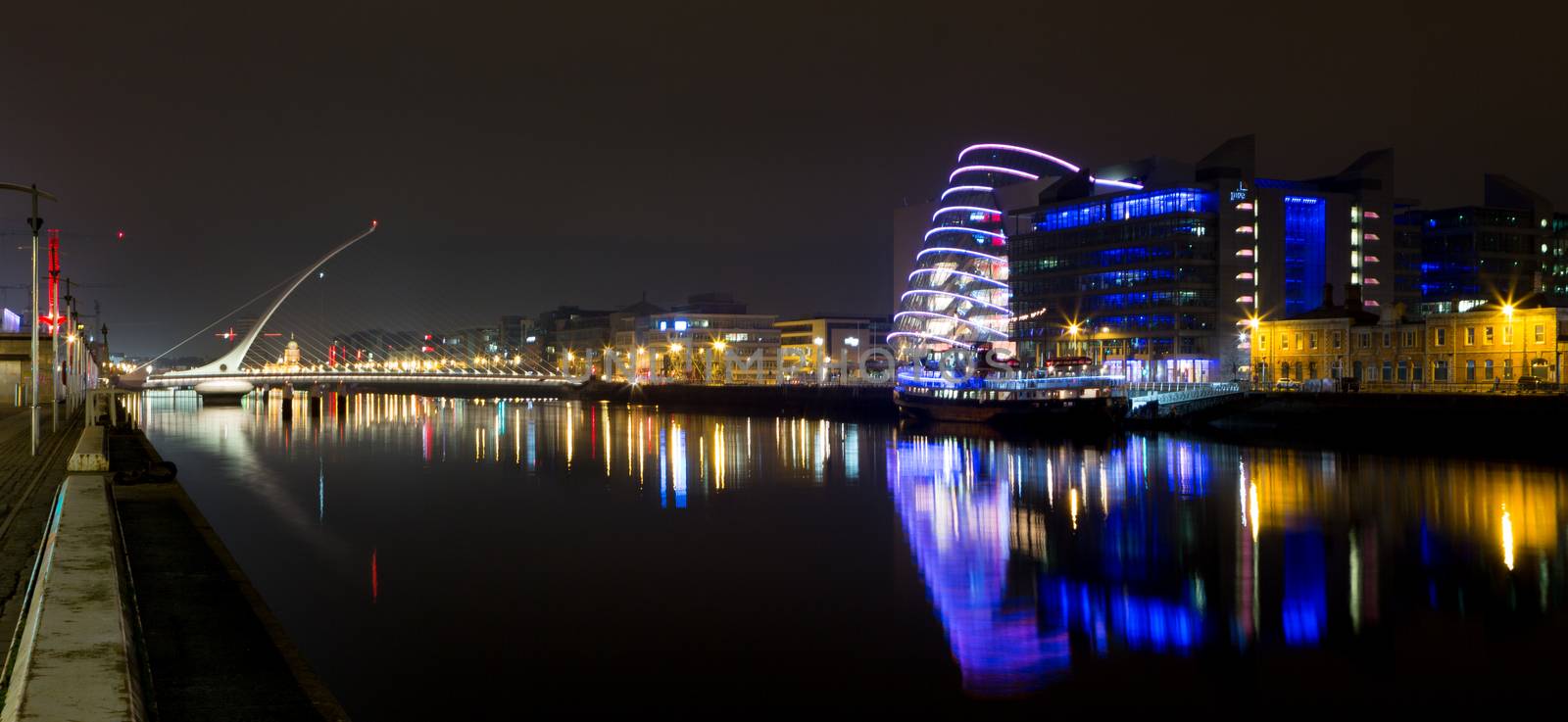 Dublin Ireland River Liffey at Night with harp bridge reflections night