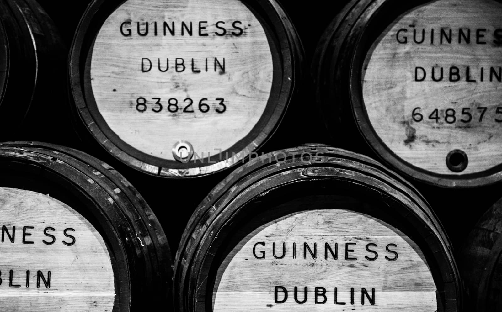 DUBLIN, IRELAND - JAN 21: Beer barrels black white gate at the Guinness Storehouse Dublin Ireland Beer UK by mlechanteur