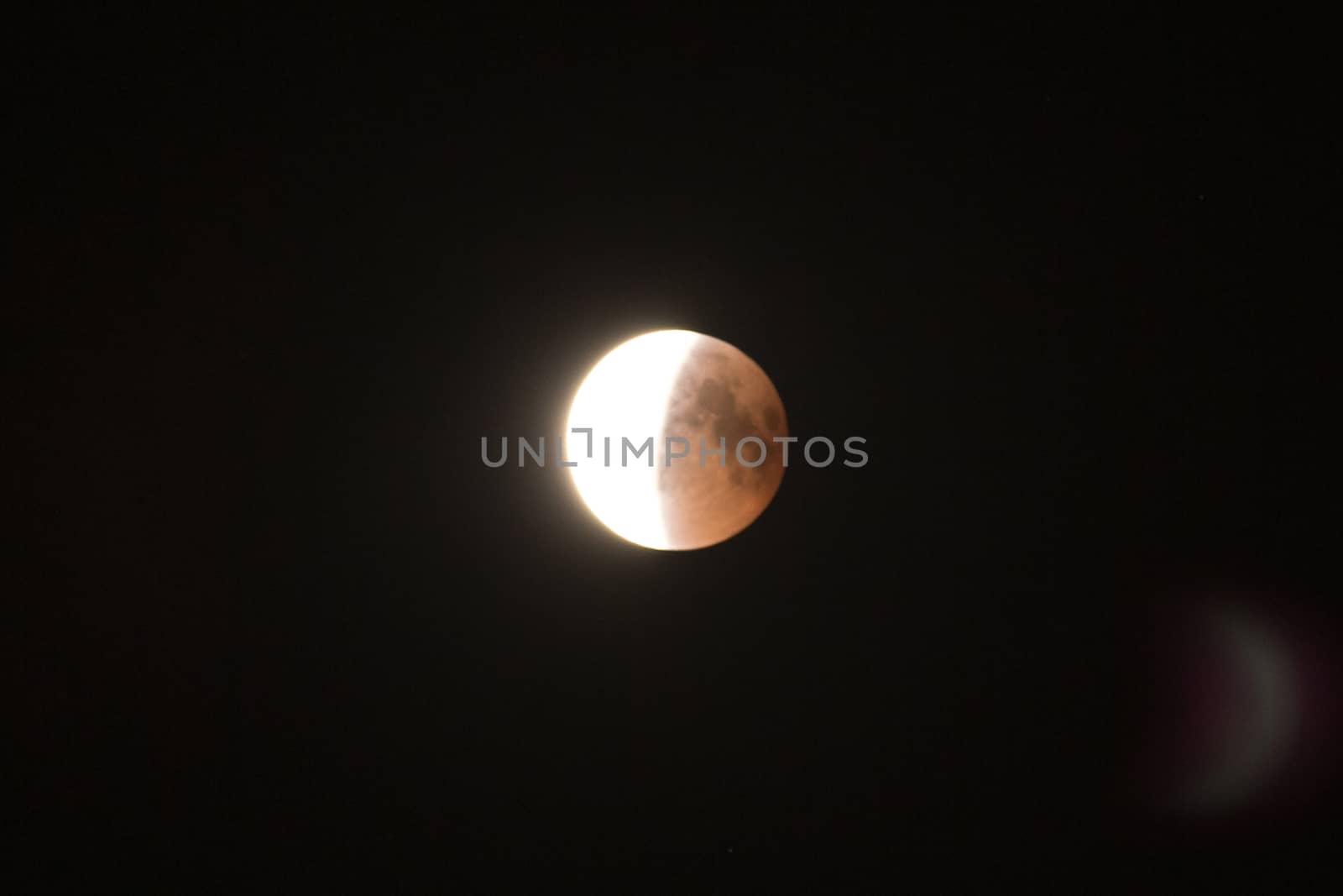 longest lunar eclipse of the century. The moon on the black sky. by TrEKone