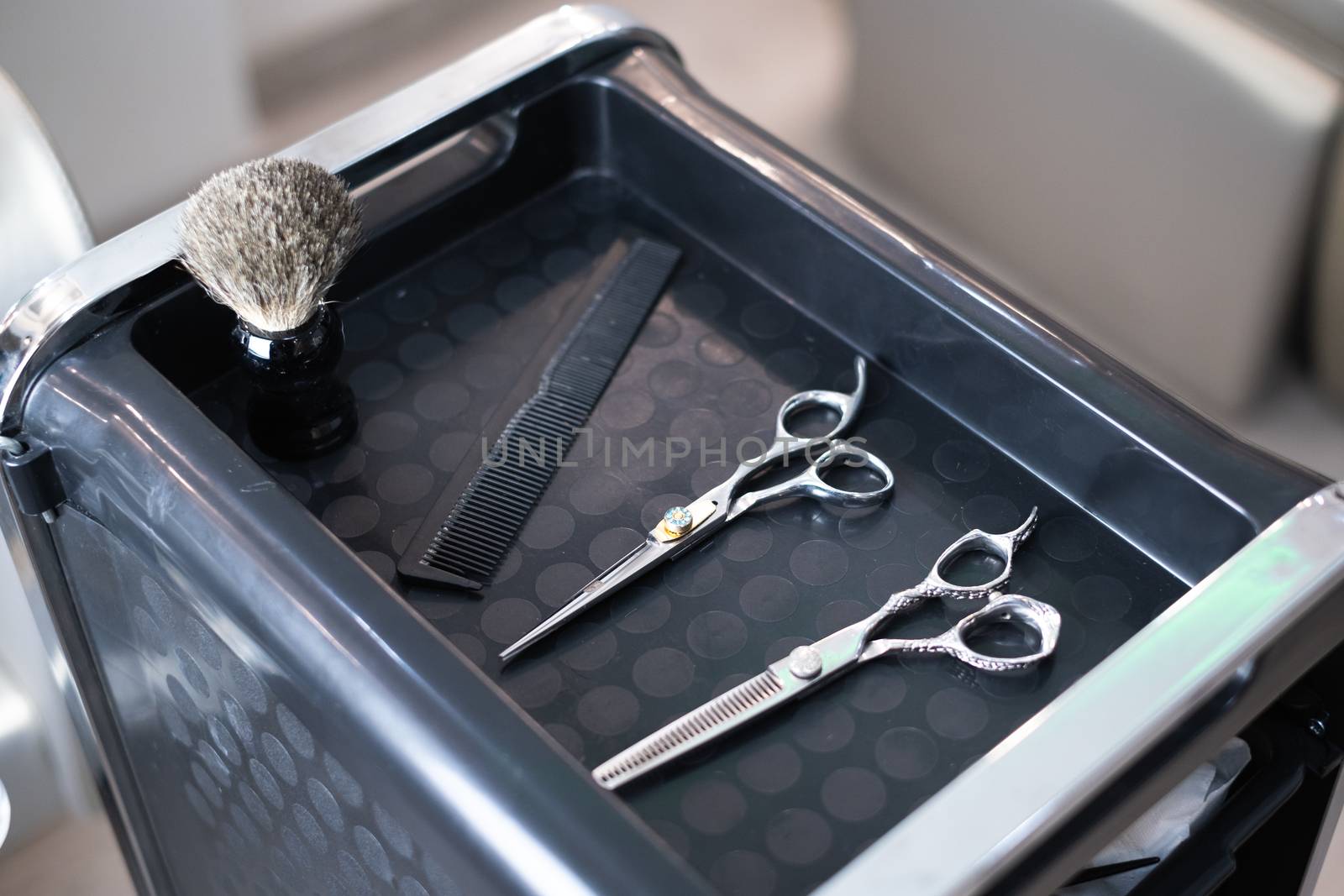 Stylish professional barber scissors and combs, hairdresser salon concept, hairdressing tool set. Haircut accessories