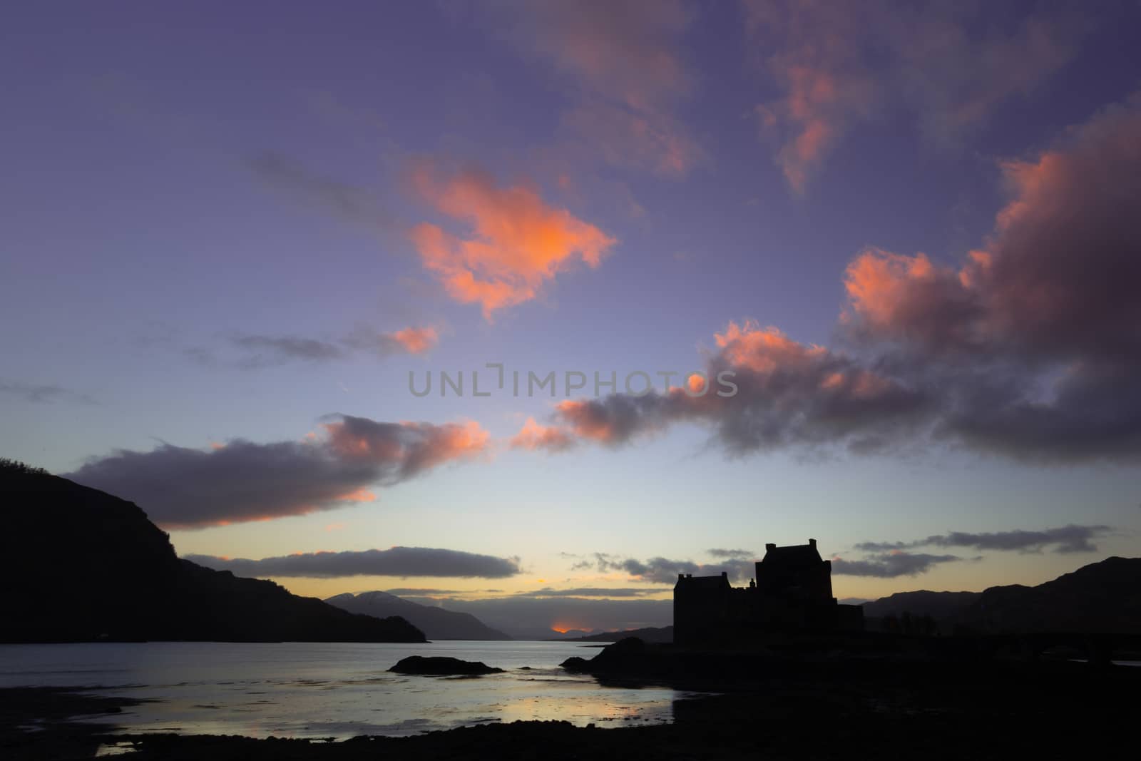 Elean donan castle sunset colorful sky orange purple