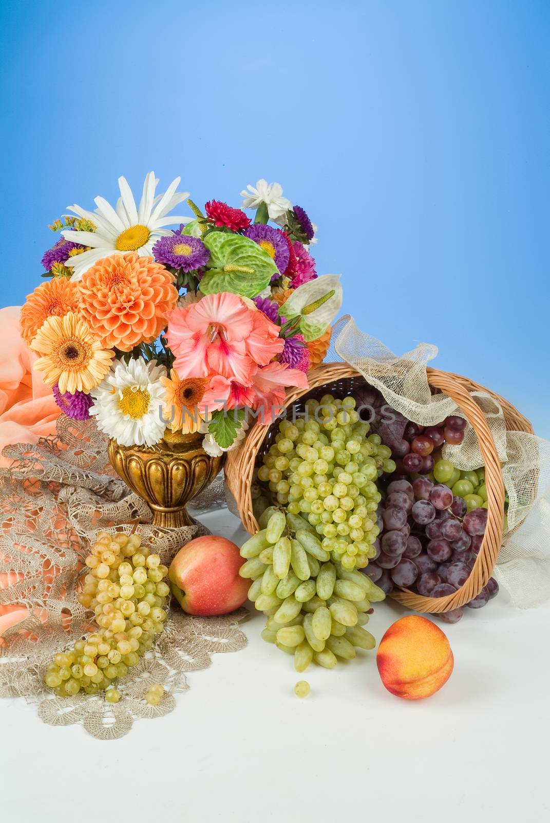 Fruits and flowers on a studio background