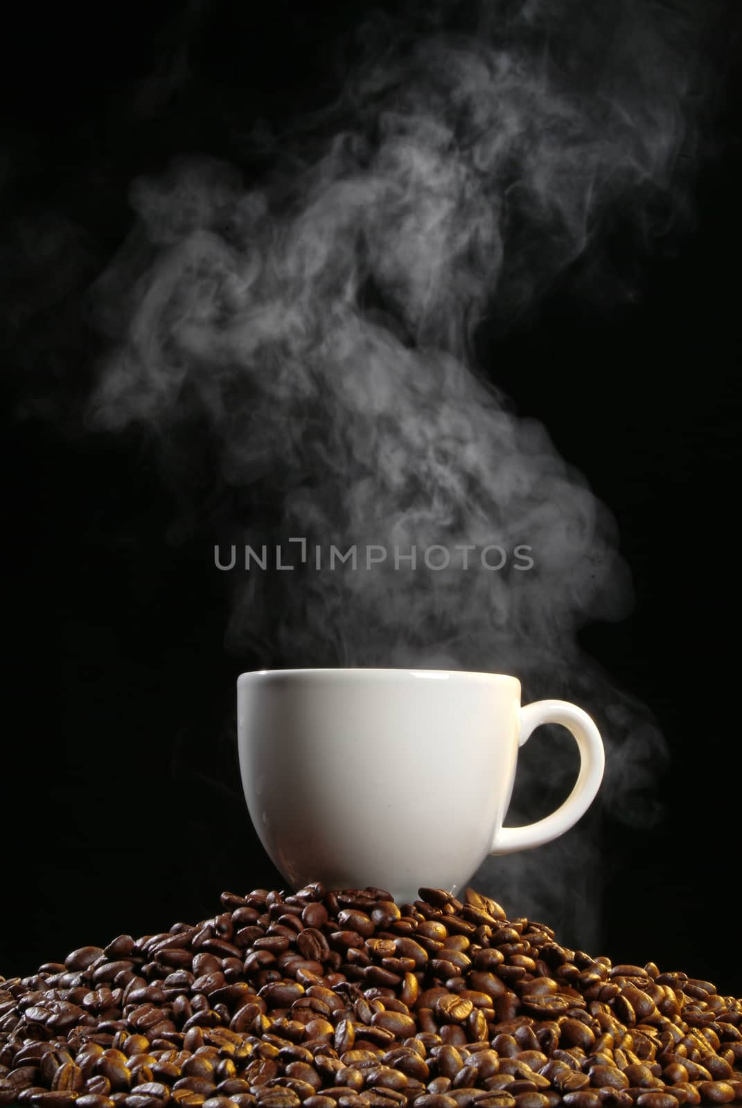 Cup of coffee with stesm on a studio background