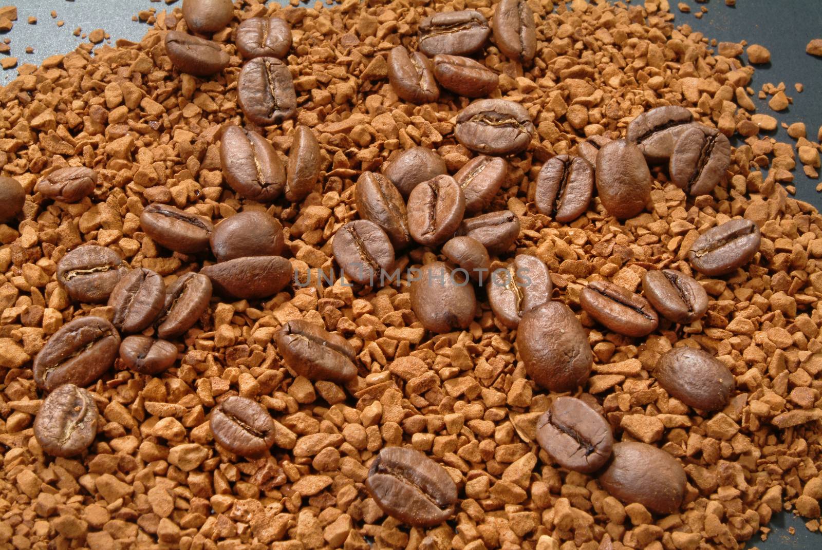 Coffee beans and powder on a studio background