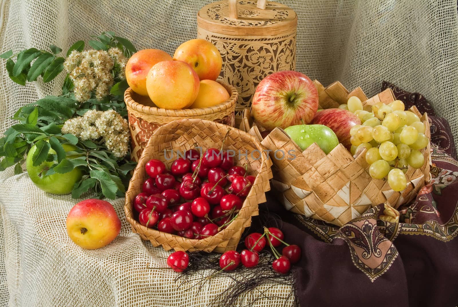 Different fruits on a canvas in traditional style