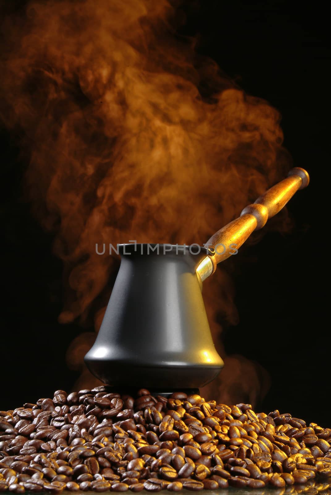 Pot with coffee on a studio background