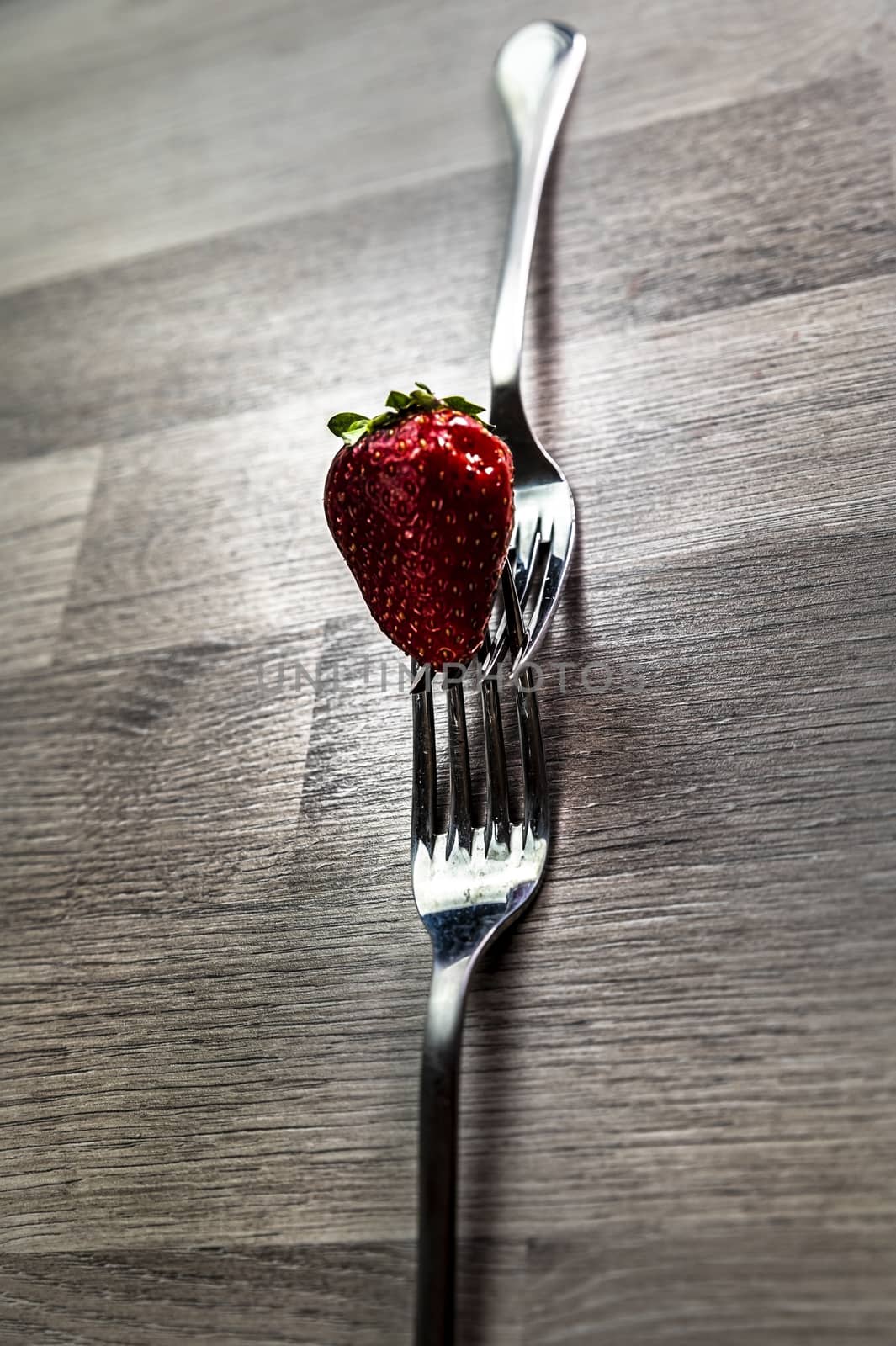 composition with strawberry and forks by carfedeph