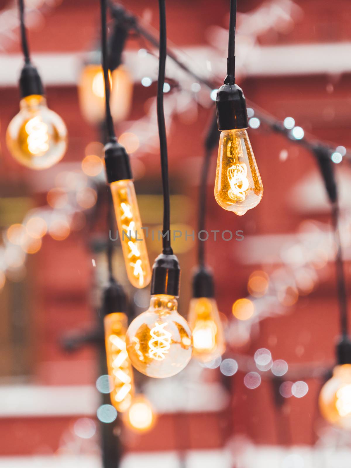 Vintage light bulbs with glow filament. Incandescent retro design. Outdoor decoration for New Year and Christmas celebration. Moscow, Russia.