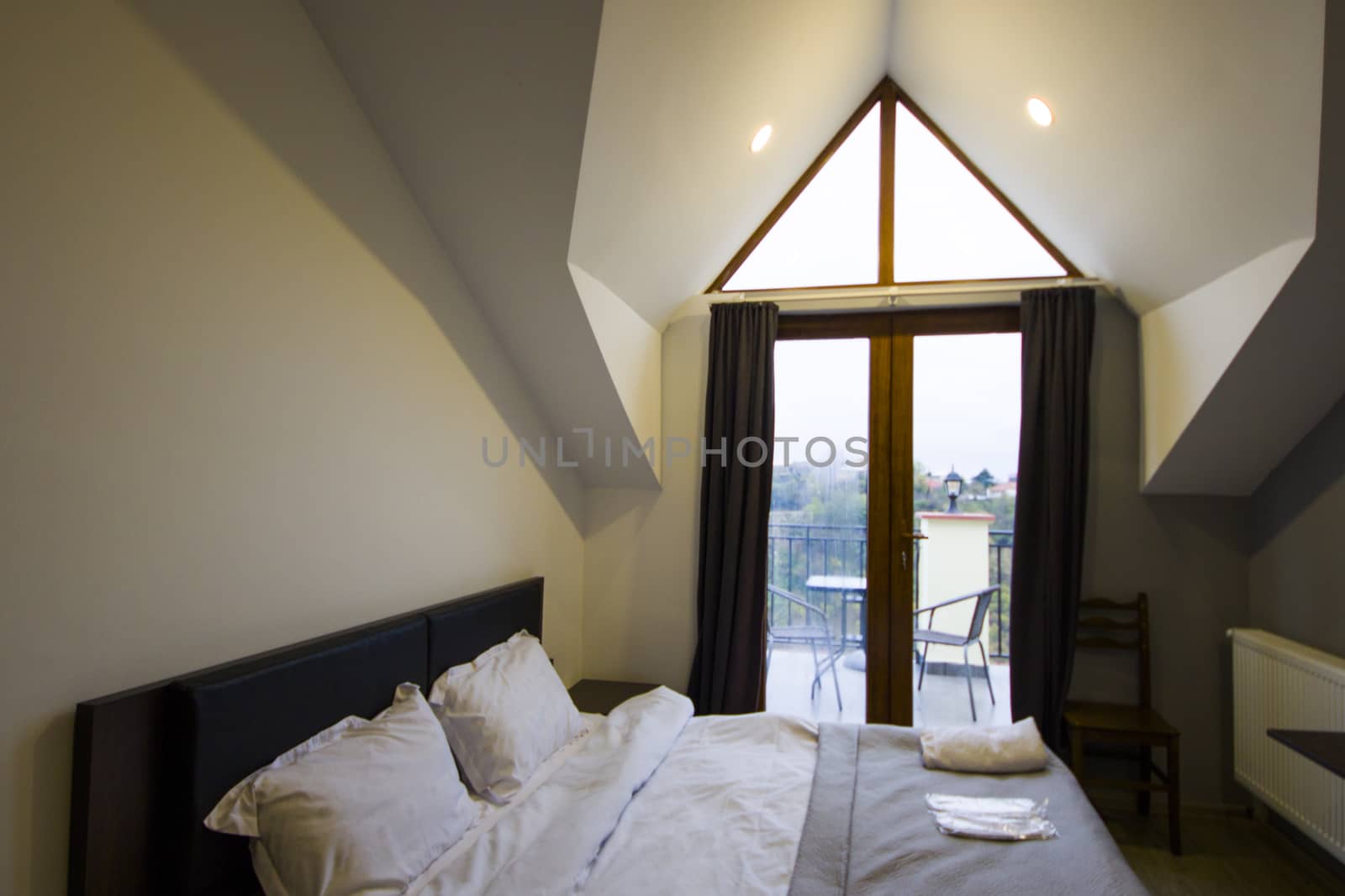 Guest house and hostel room interior, bed and table
