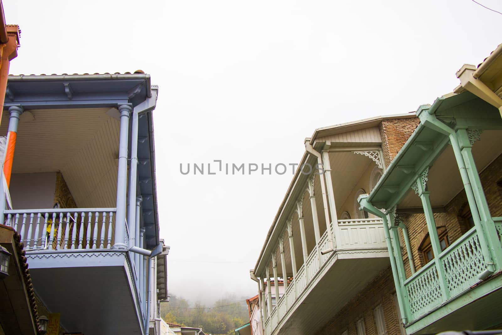 Sighnaghi village house wooden balcony, colorful houses by Taidundua