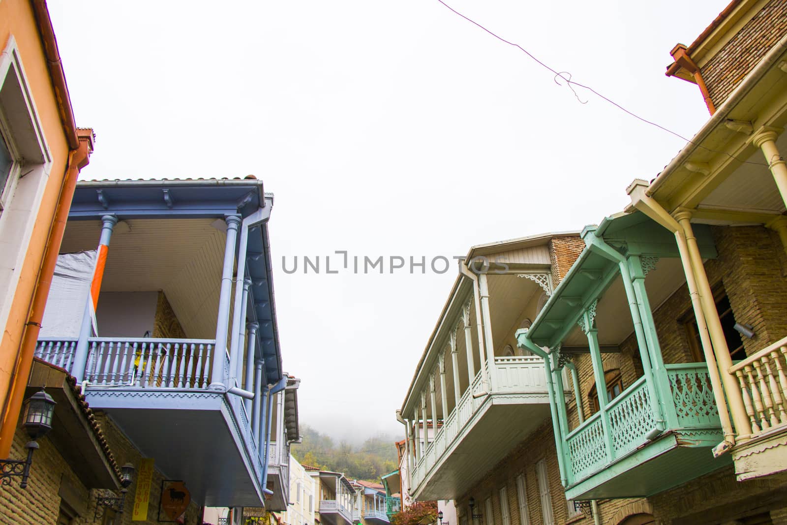 Sighnaghi village house wooden balcony, colorful houses by Taidundua