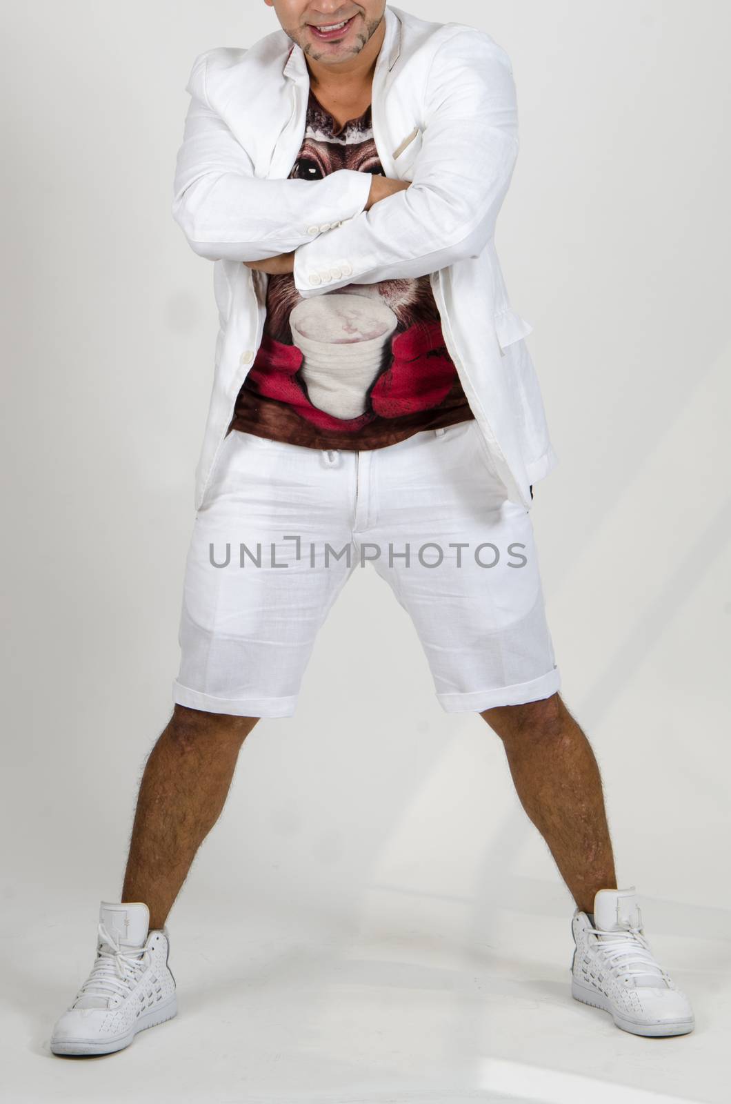 Attractive african man with crossed arms laughing at camera