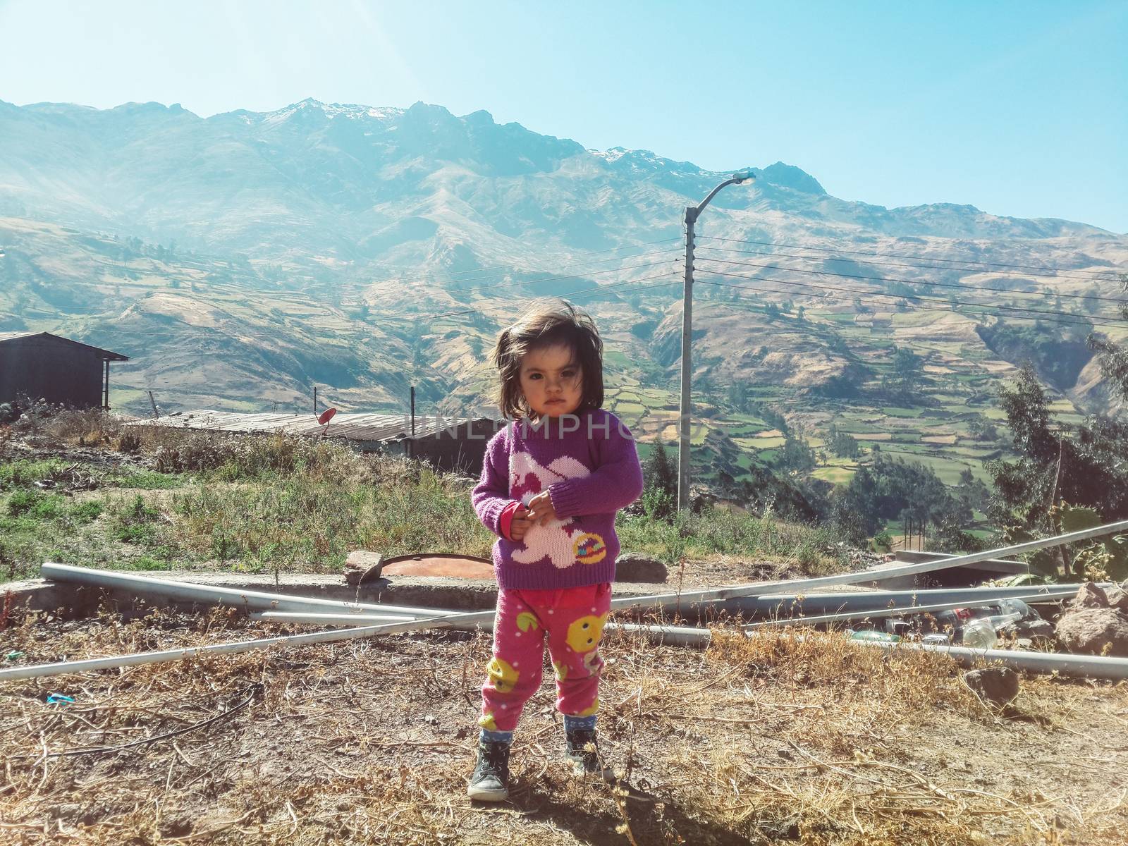 Portrait of a cute little girl in the mountains, in Canta north of the capital of Lima in Peru