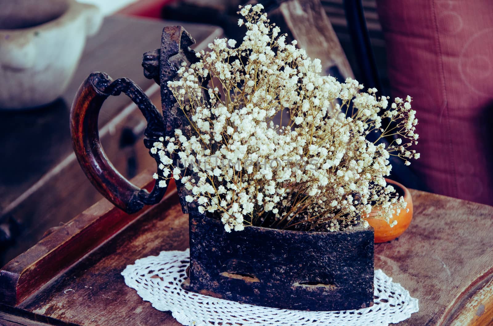 Antiques. Old iron, jug and vase. Old things. Retro decorated with flowers