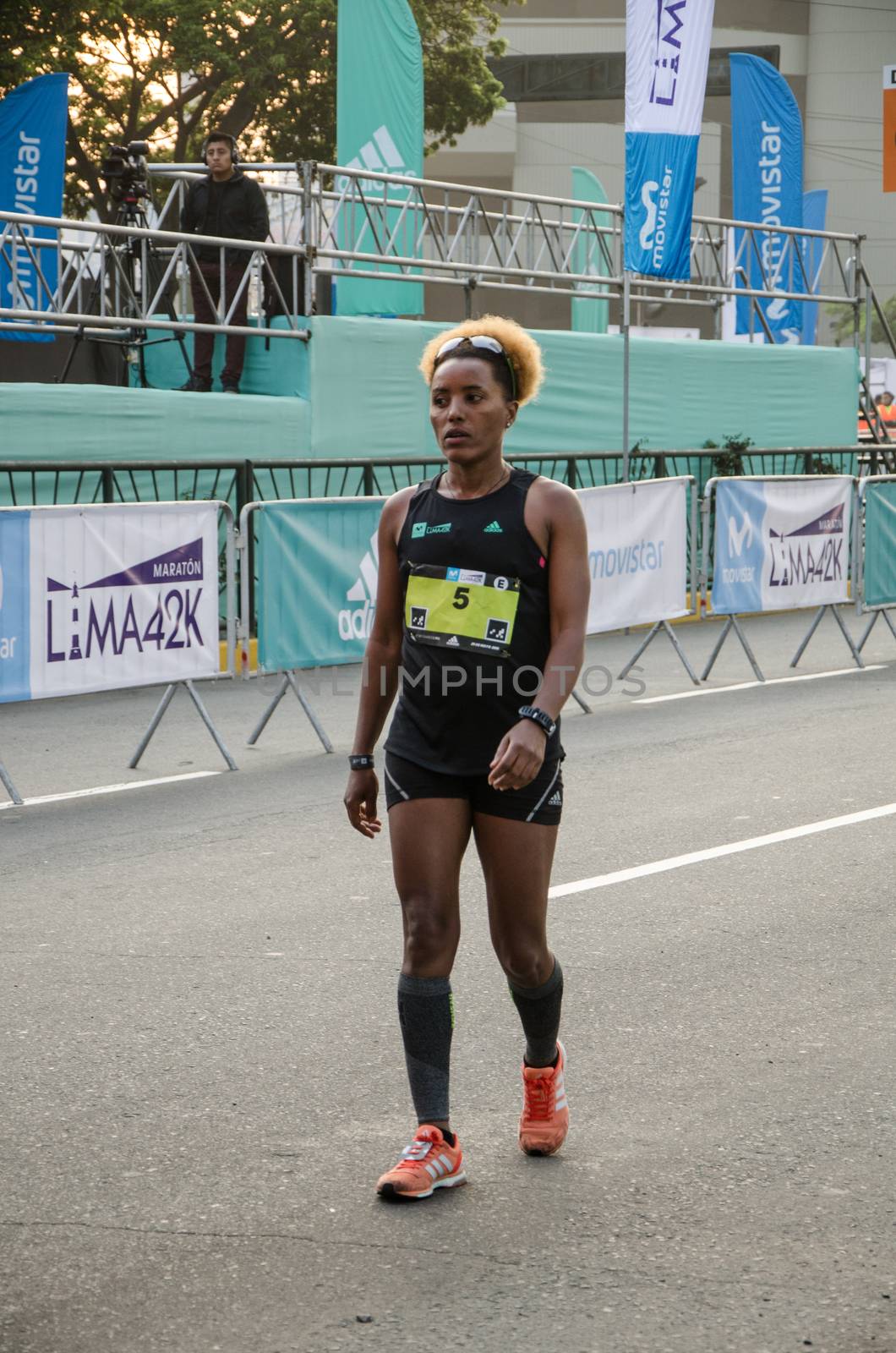 Lima, Peru - May 20th 2018: Marathon Lima 42k, sporting event that gathers athletes from all over the world. Elite athletes stretching before the marathon.