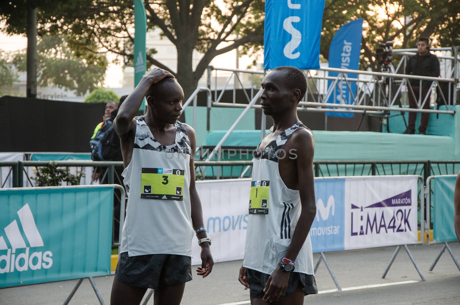 Lima, Peru - May 20th 2018: Marathon Lima 42k, sporting event that gathers athletes from all over the world. Elite athletes stretching before the marathon.