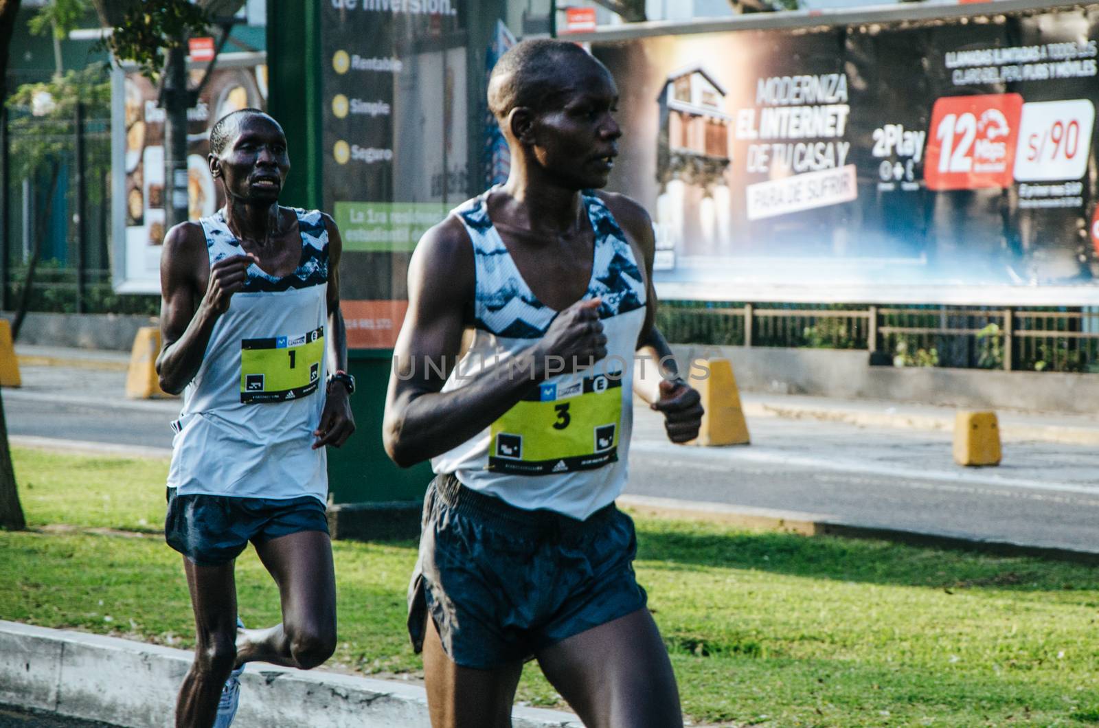 Lima, Peru - May 20th 2018: Marathon Lima 42k, sporting event that gathers athletes from all over the world. Elite athletes stretching before the marathon.