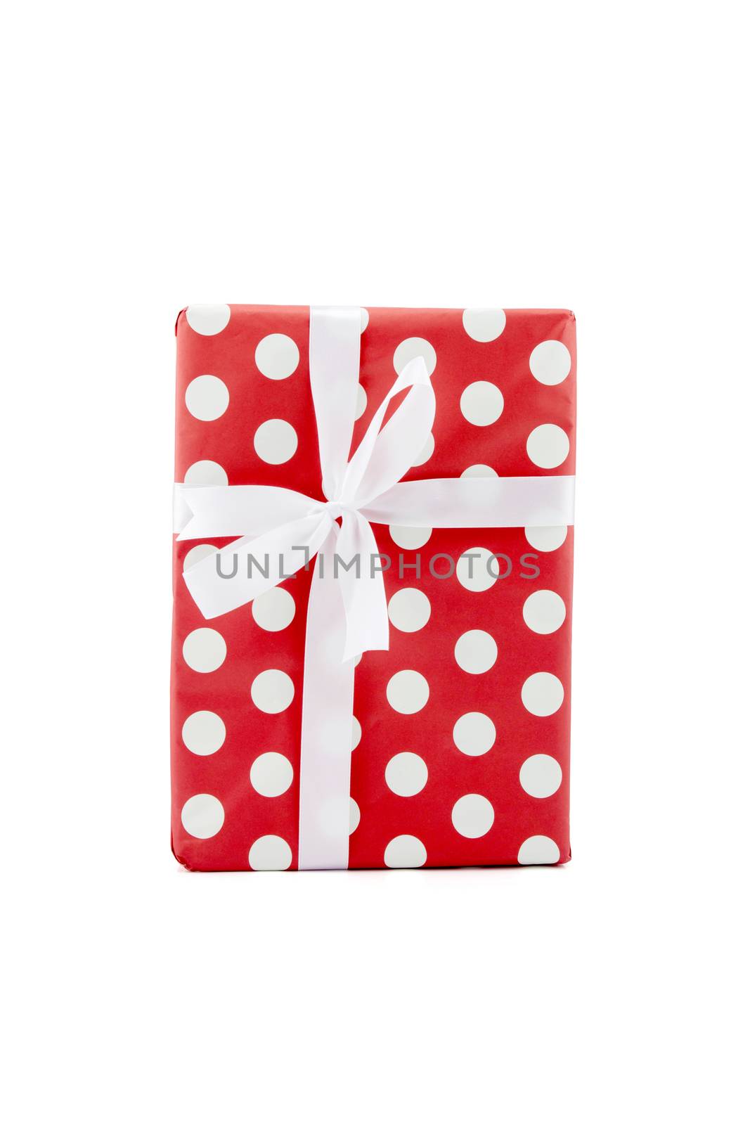 Red gift box and white ribbon in season Christmas and new year isolated on white background, luxury present for birthday or anniversary with surprise in package for happy, holiday concept.