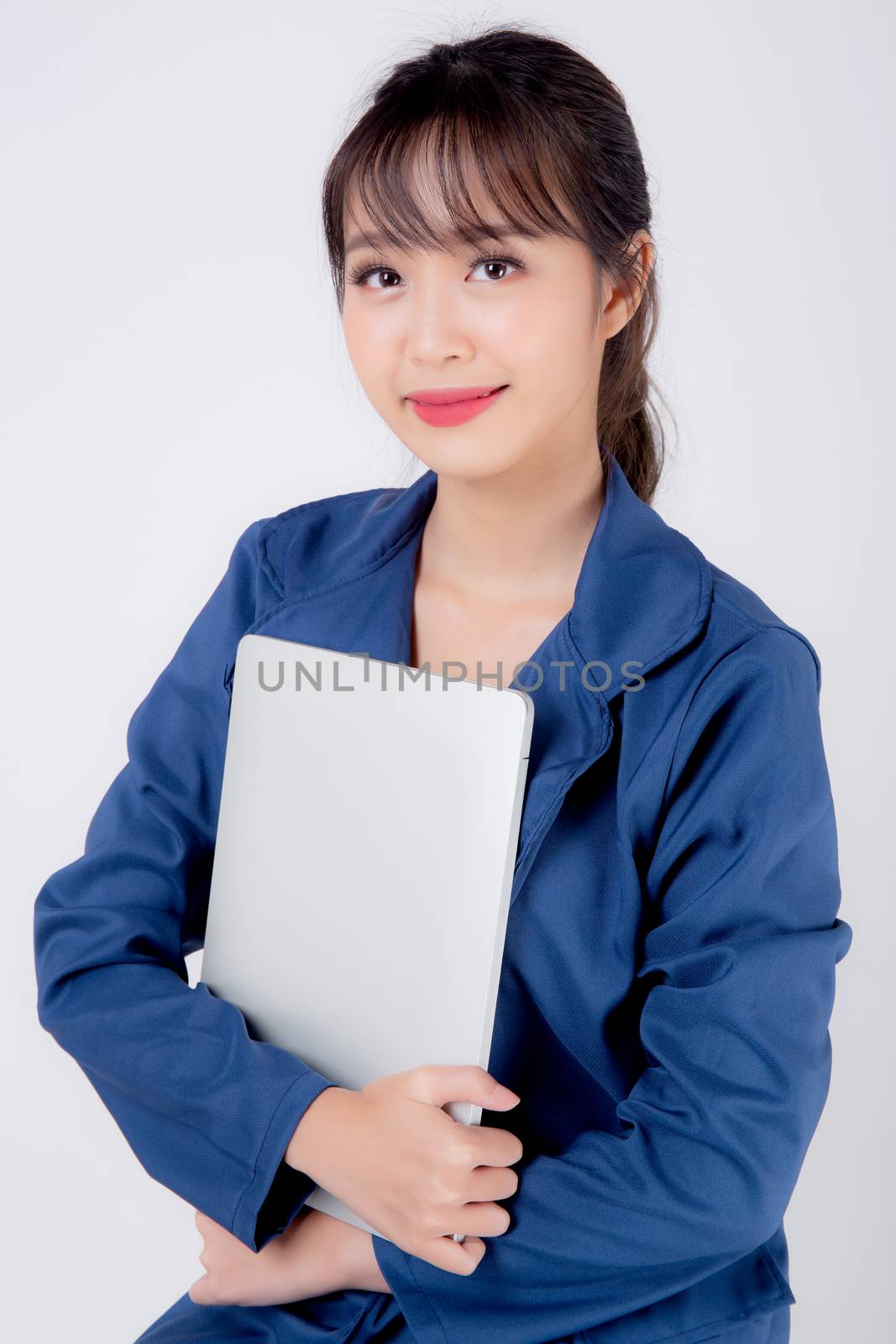 Beautiful portrait young asian business woman holding laptop computer isolated on white background, businesswoman using notebook, asia freelance girl work job surfing internet online or sending email.