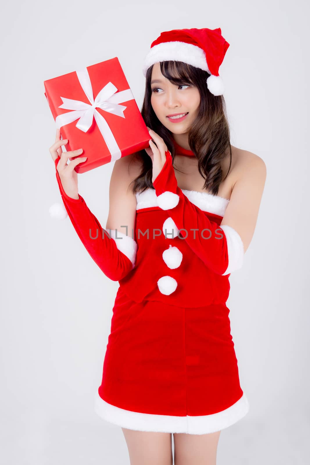 Beautiful portrait young asian woman happy holding red gift box  by nnudoo