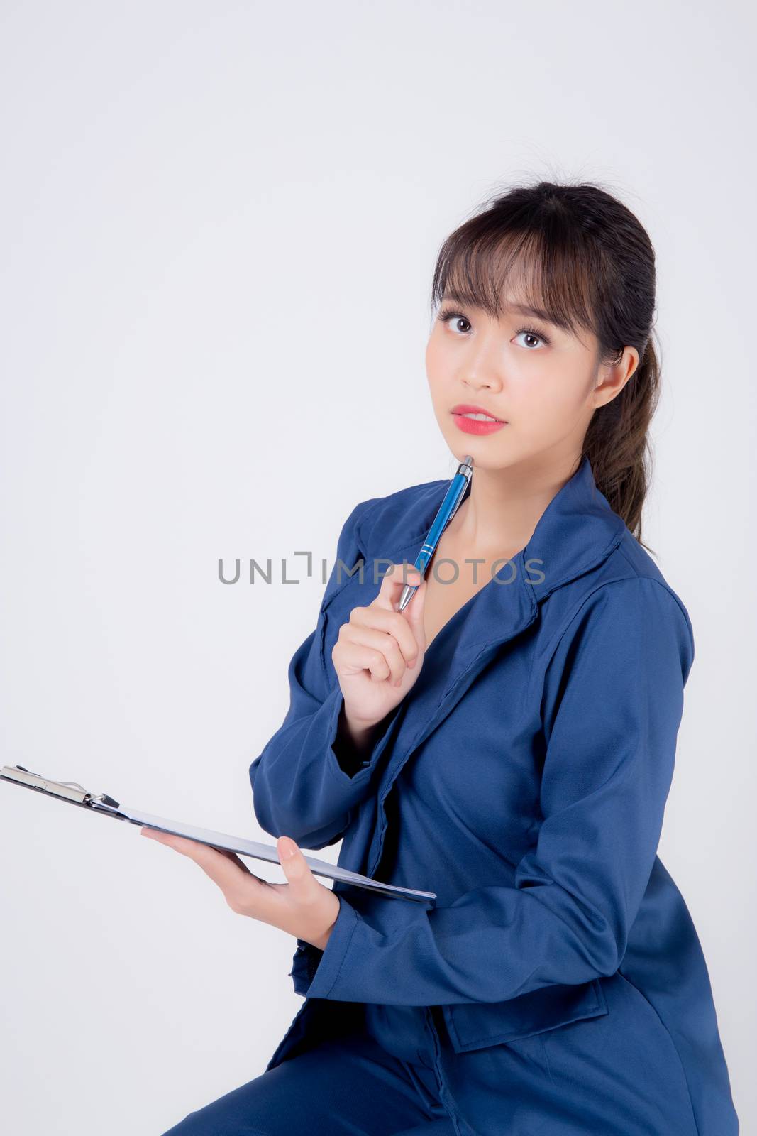Beautiful portrait young business asian woman thinking and note on clipboard for success isolated on white background, confident businesswoman planning and idea for inspiration and successful in job.