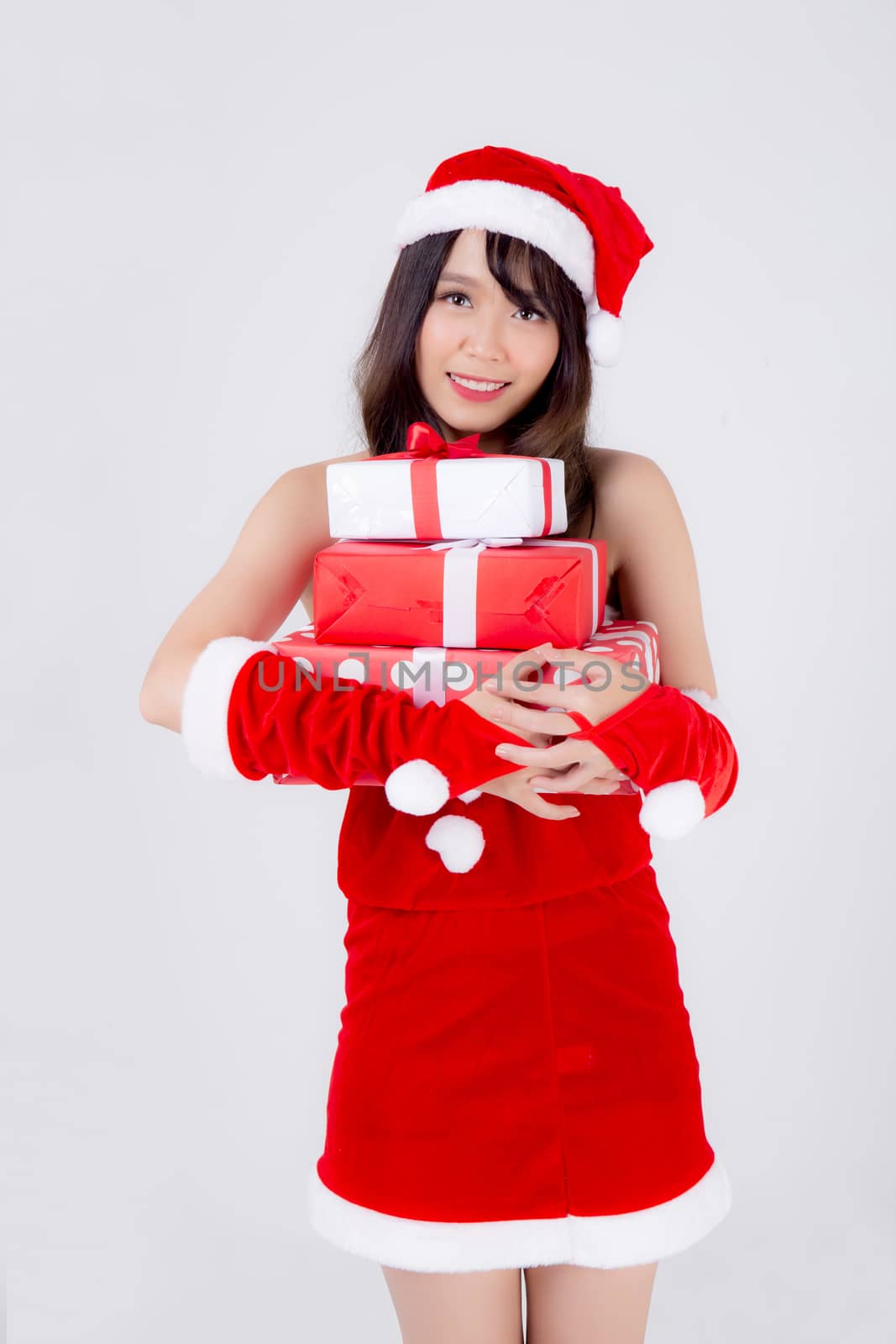 Beautiful portrait young asian woman happy holding lot of gift box with excited in xmas holiday isolated on white background, asia girl surprise and celebrating in festive Christmas and new year.