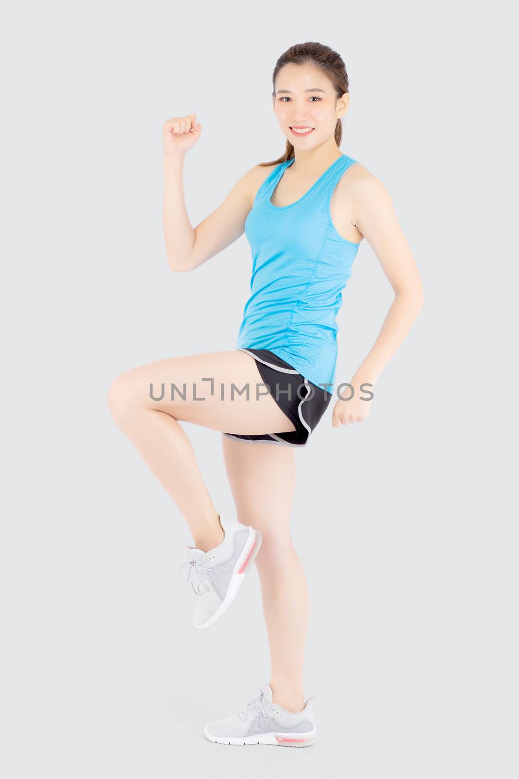 Beautiful portrait young asian woman in sport clothes cheerful w by nnudoo
