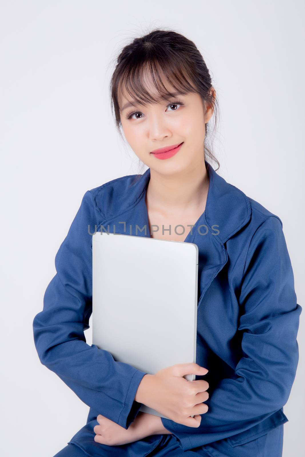 Beautiful portrait young asian business woman holding laptop com by nnudoo