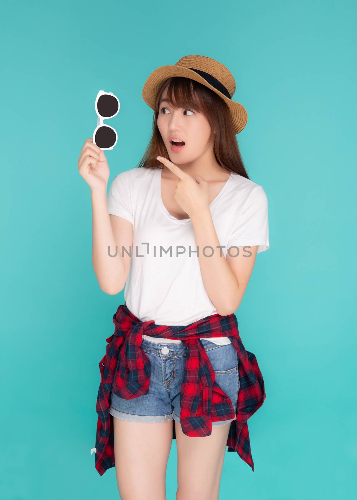 Beautiful portrait young asian woman wear hat and holding and po by nnudoo