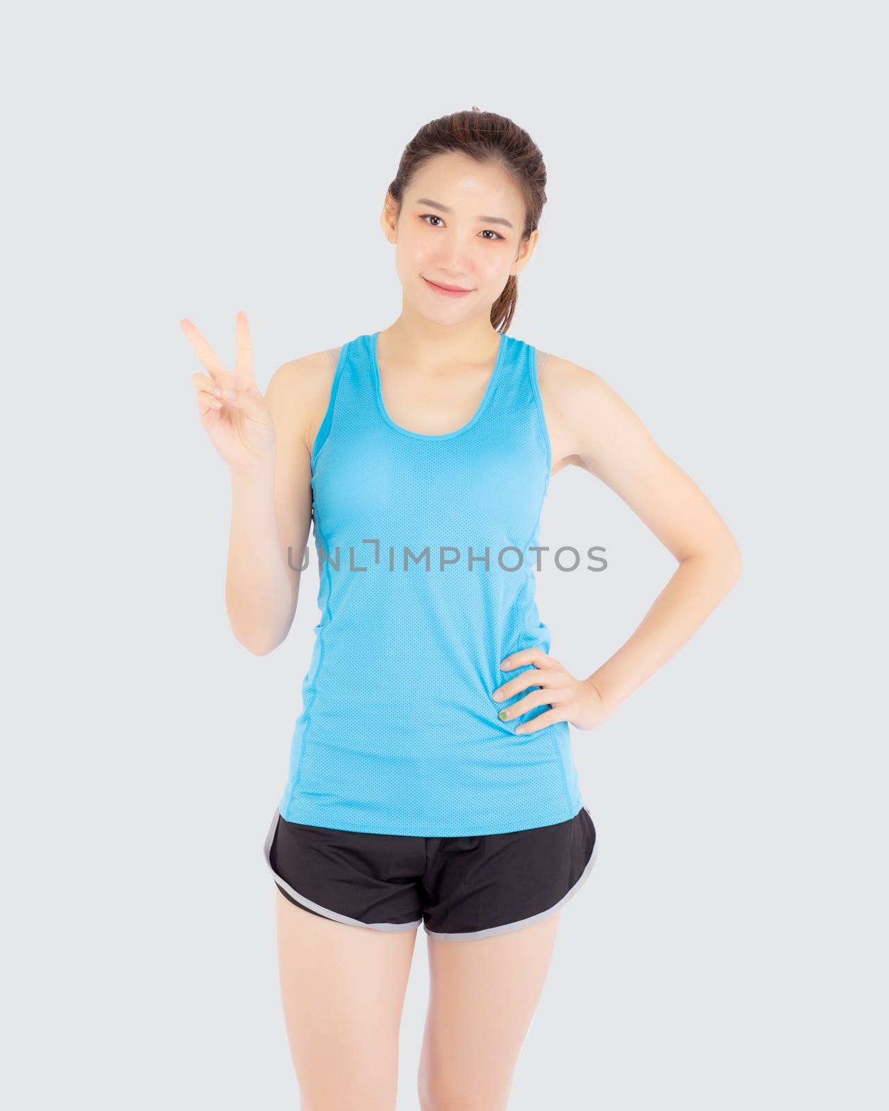 Beautiful portrait young asian woman in sport clothes with satisfied and confident gesture finger v sign isolated on white background, asia girl have shape and wellness, exercise for fit with health.