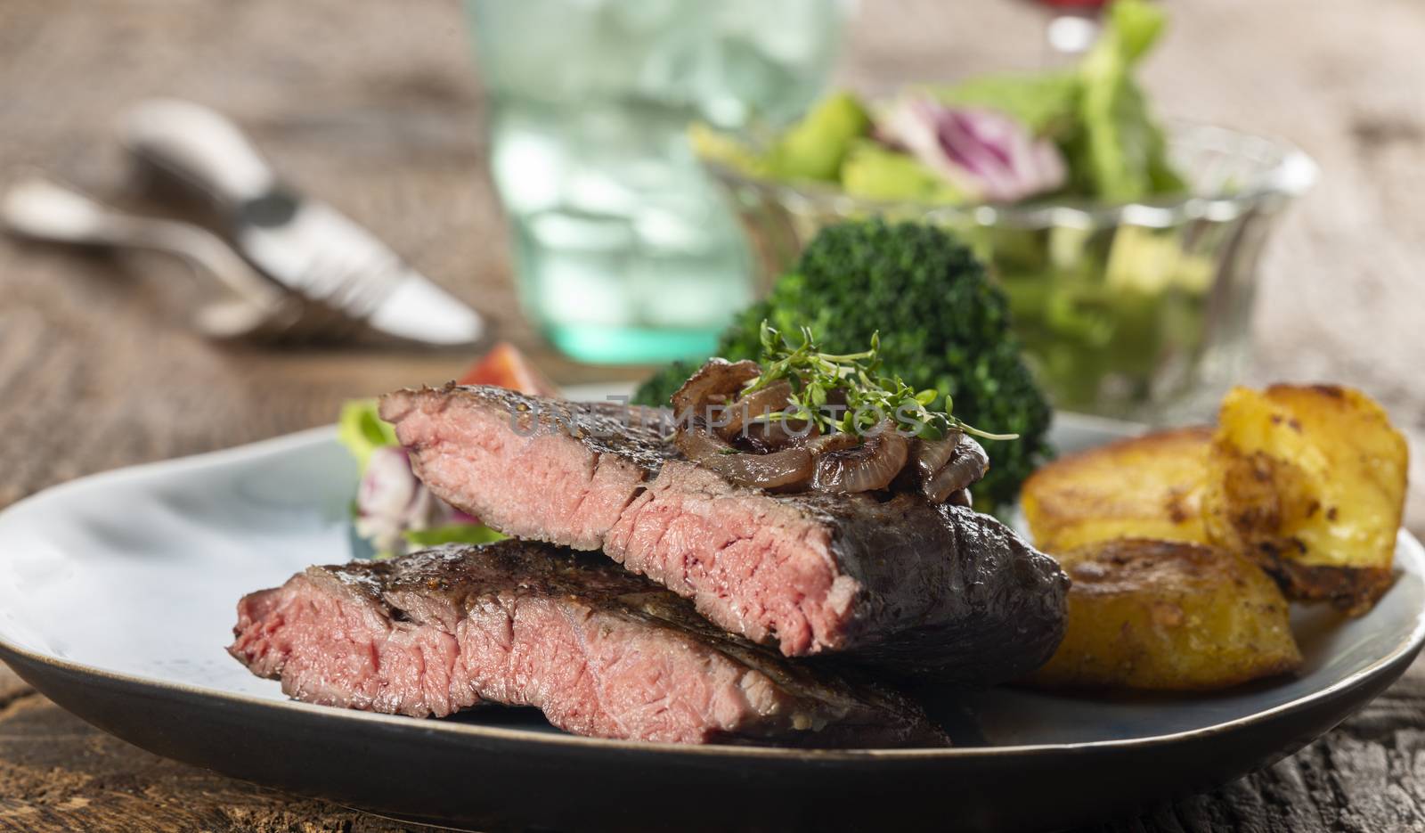 halves of a steak on a plate