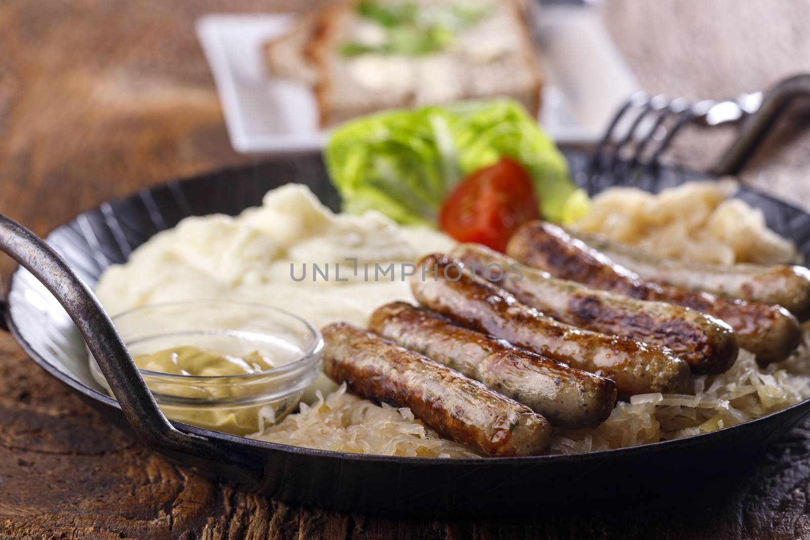 nuremberg sausages in a serving pan