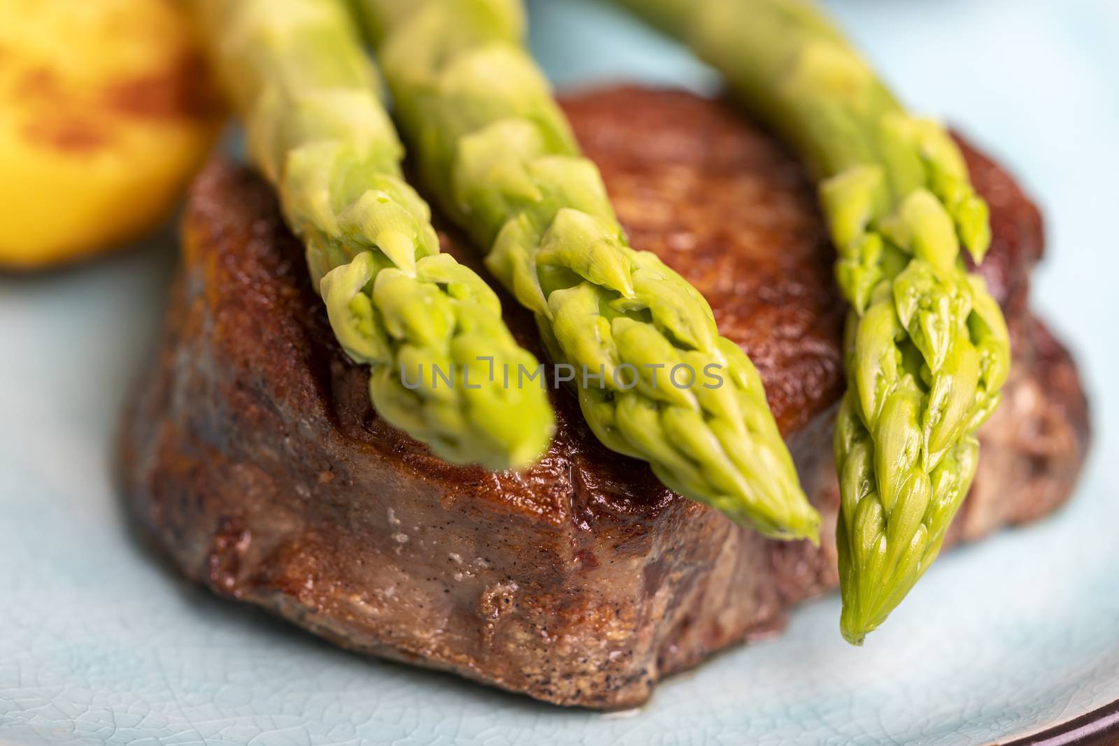 asparagus with potatoes and a steak