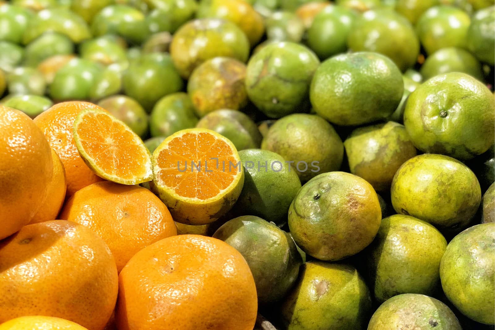 Fresh oranges fruits at market by Surasak