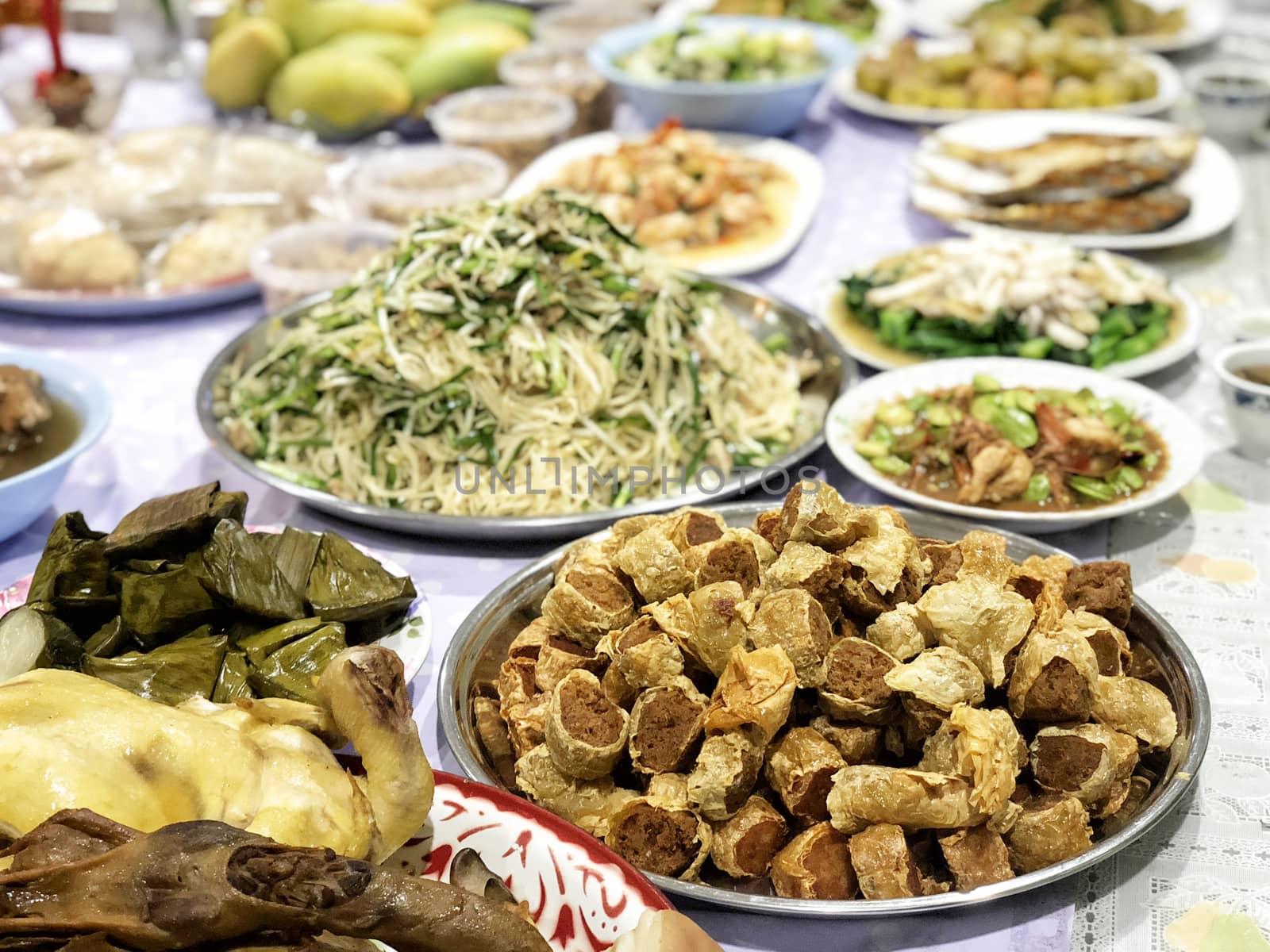 Chinese Ghost Festival. Sacrificial offering food for pray to go by Surasak