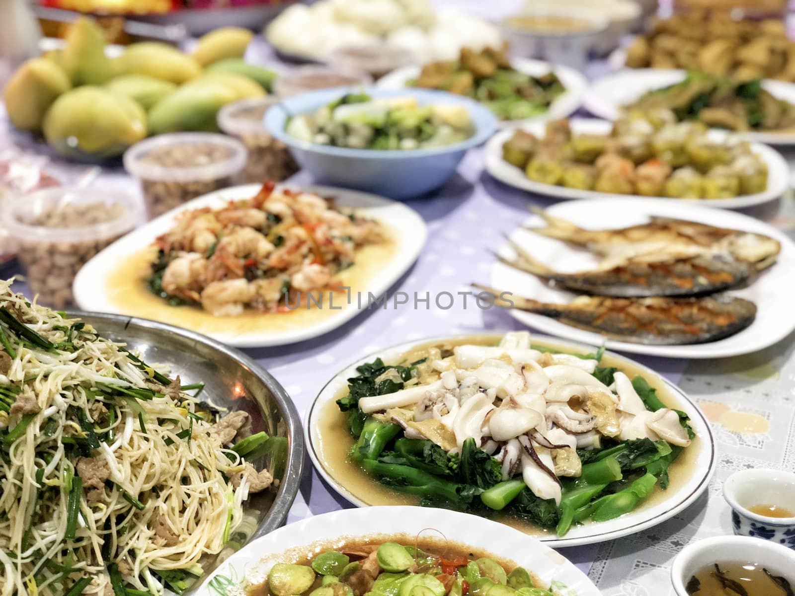 Chinese Ghost Festival. Sacrificial offering food for pray to go by Surasak