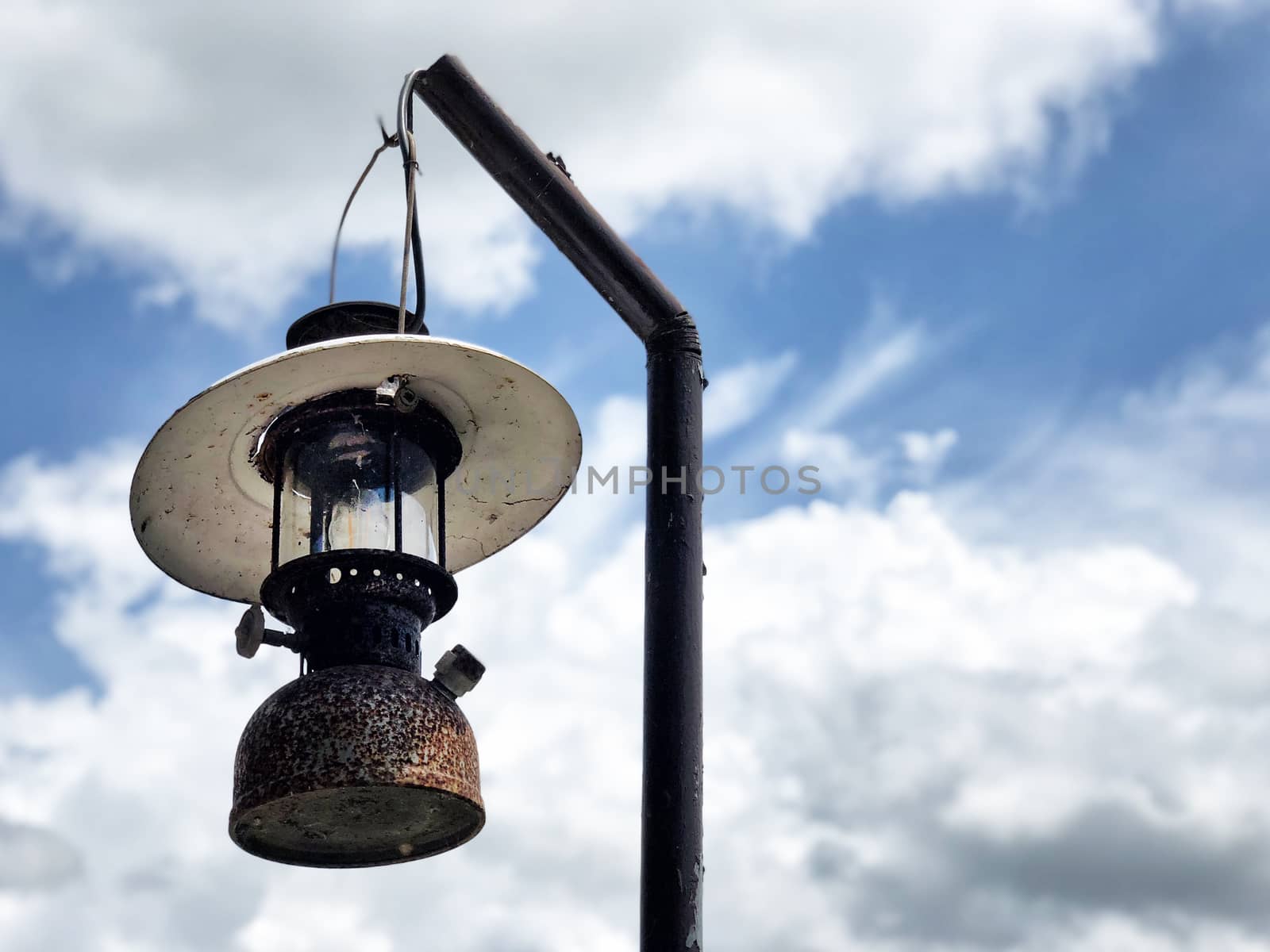 Vintage Lantern hanging and blue sky background by Surasak