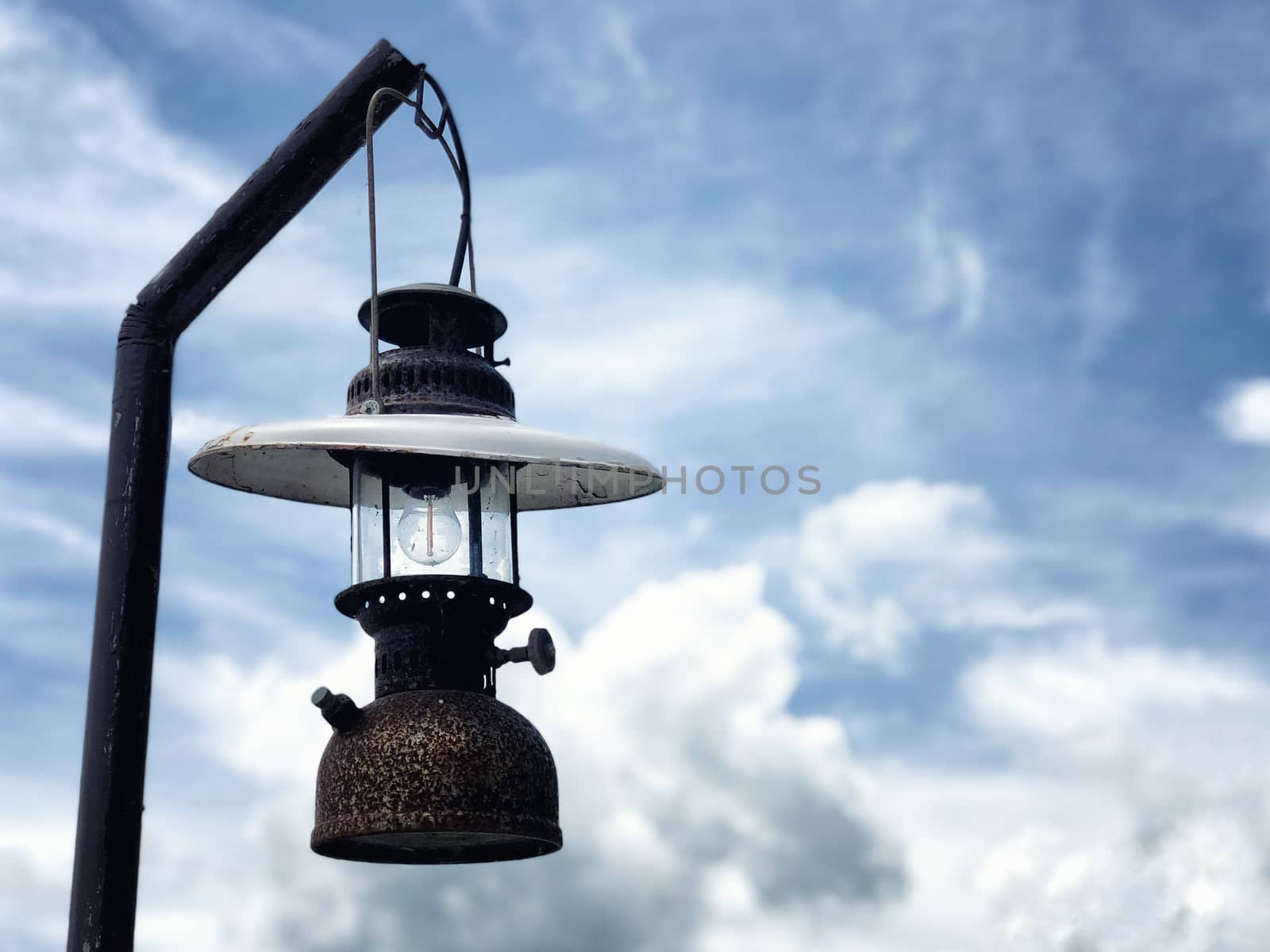 Vintage Lantern hanging and blue sky background by Surasak