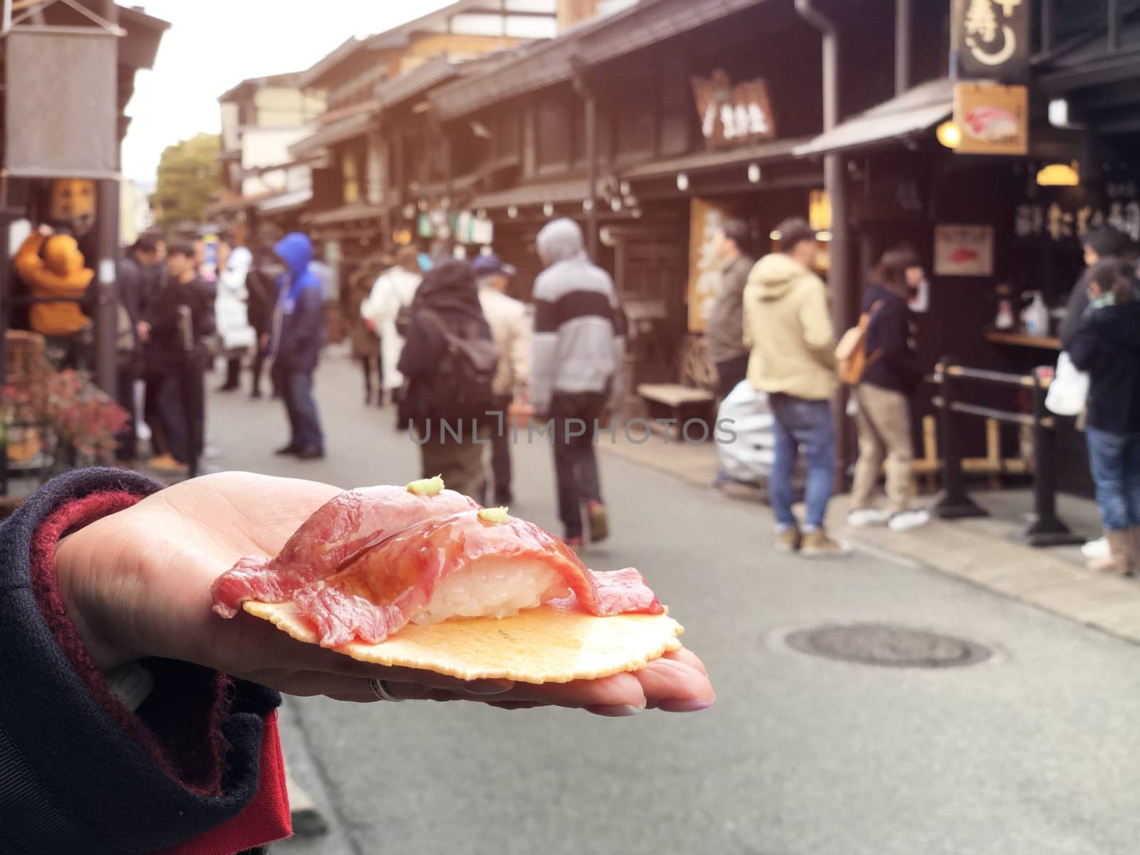 Japanese street food close-up Hida Beef Sushi and cracker at Tak by Surasak