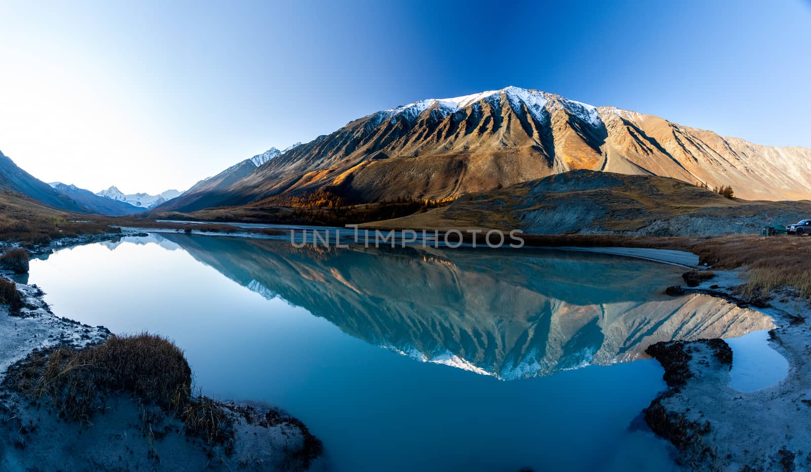 Lake in the Altai Mountains. Panorama of the Altai landscape in the mountains. The time of year is autumn.