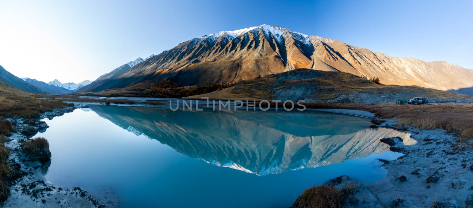 Lake in Altai Mountains. Panorama of the Altai landscape in the mountains. The time of year is autumn. by DePo