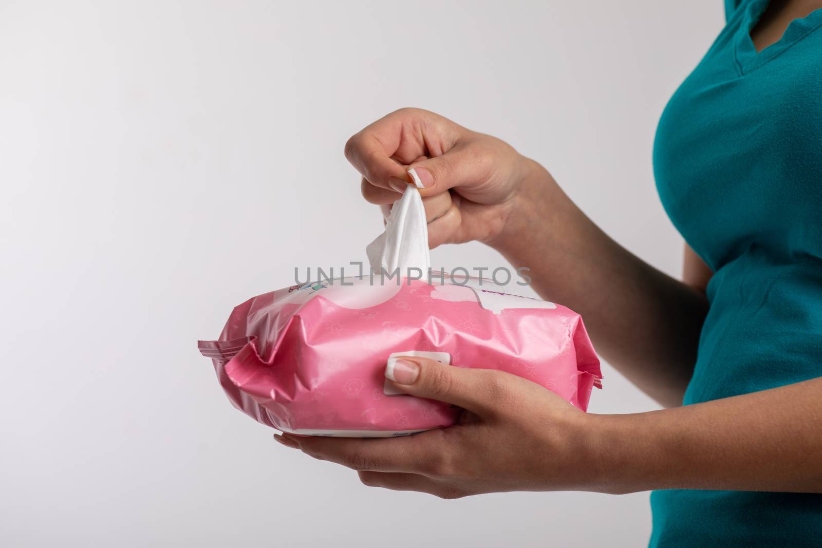 Taking baby wet wipes from the packaging - hygiene procedure and by adamr