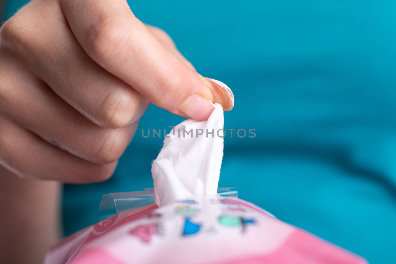 Taking baby wet wipes from the packaging - hygiene procedure and prevention of infectious diseases