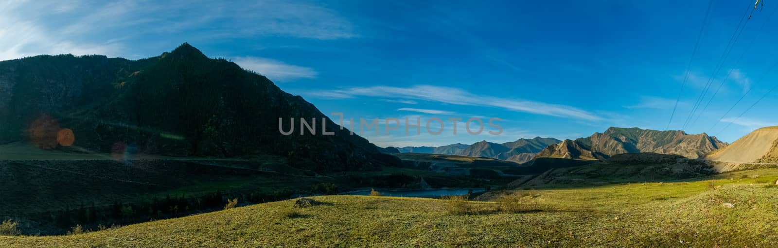 Panorama is the Altai, a mountain river flowing between the Altai mountains and the nature of the area.